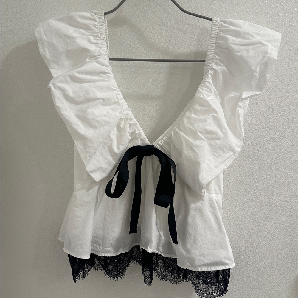 By Anthropologie
 Bow Ruffle-Sleeve Babydoll Blouse